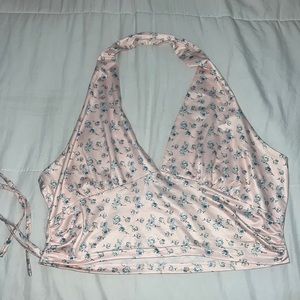 Pink floral halter top, low cut, with side string.